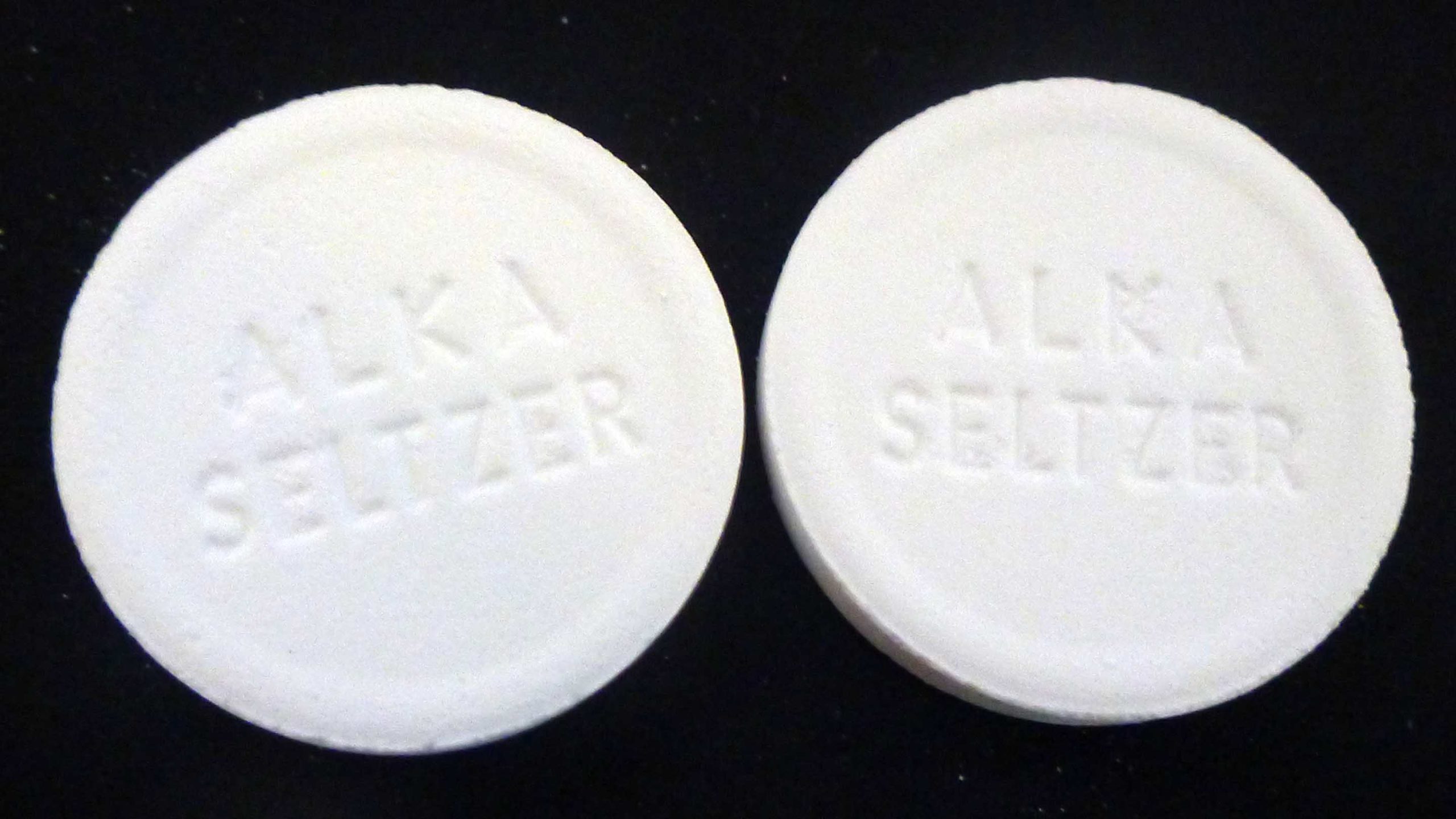 Two white ALKA-SELTZER tablets