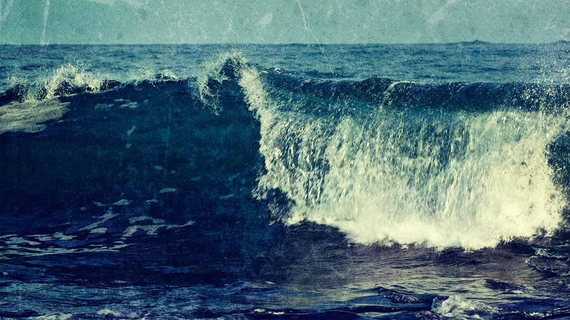 Vintage rImage of wave close up in ocean with grunge texture overlaid. Sri Lanka