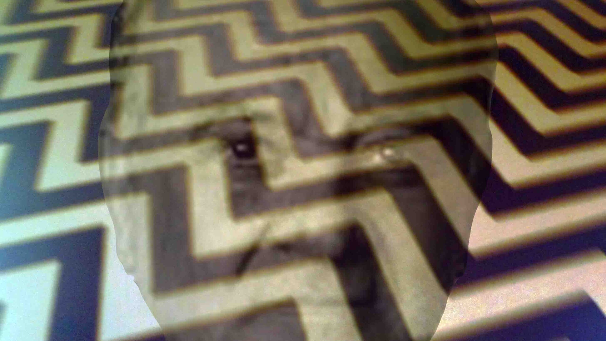 Angelo Badalamenti's face superimposed over the iconic "Red Room" floor from TWIN PEAKS